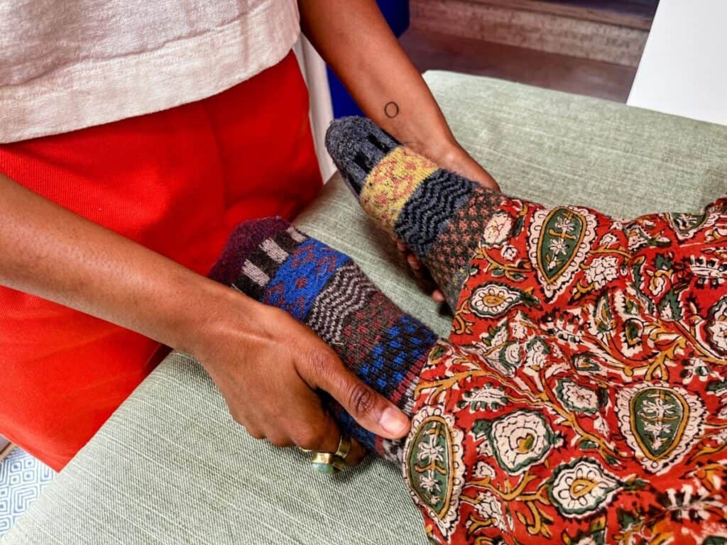 Vineeta holding sammi's toes doing reiki